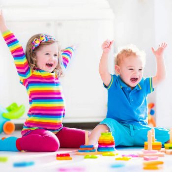 Kids throwing their arms up