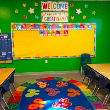 Desks ready for students in a preschool classroom